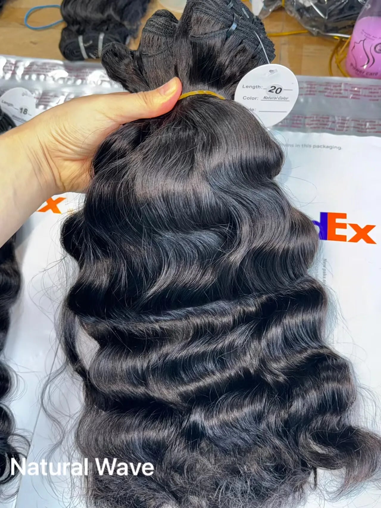 Raw Virgin Human Hair Bundles displayed in natural wave texture, showcasing premium quality and versatility.